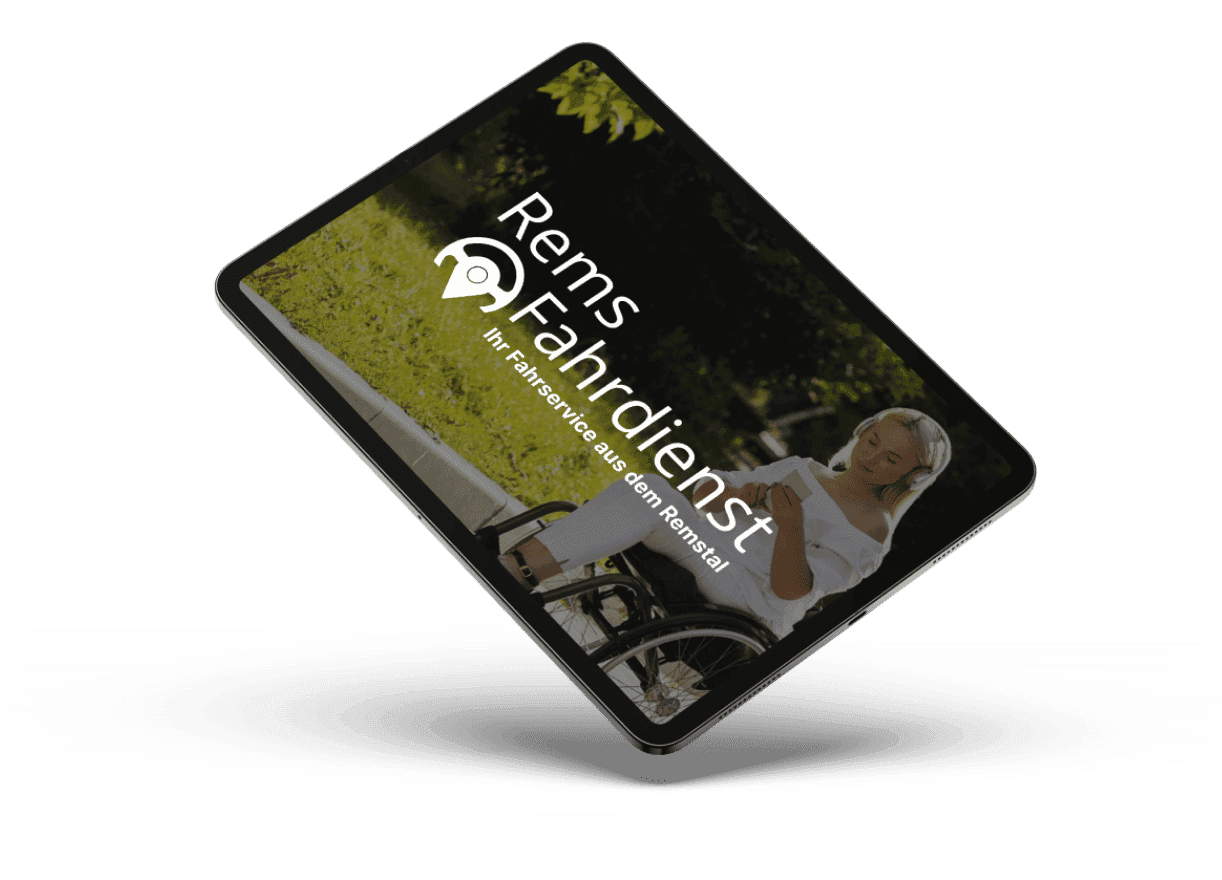 Tablet displaying a woman in a wheelchair using a phone outdoors. Bright greenery surrounds her. Text reads "Rems Fahrdienst, Ihr Fahrservice aus dem Remstal."